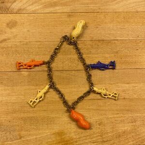 Vintage Planters Mr. Peanut celluloid charm bracelet 7” 1940 1950 gold tone